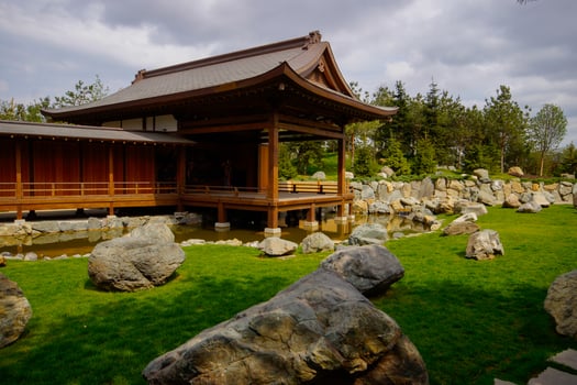A beautiful Japanese garden with a pond and Tahoto Pagoda in the distance. Japanese garden in the public park of the city of Krasnodar, Russia. photo