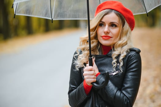 Beautiful girl with umbrella at autumn park. photo