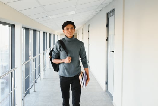 Happy indian male student at the university photo