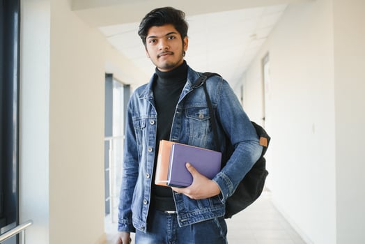 Happy indian male student at the university photo