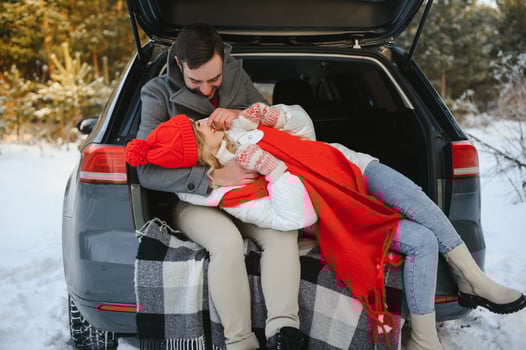 Photo of young attractive couple happy positive smile look each other enjoy time together forest winter love story