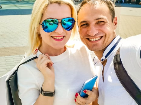 young couple handsome brunette man and beautiful woman in sportswear doing selfie on smartphone during street workout, healthy fit lifestyle. photo