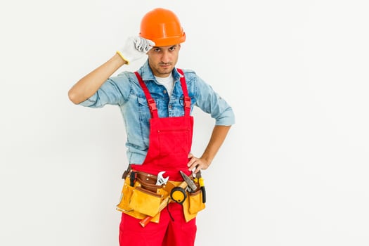 Young construction workers with hard hats on a white background photo