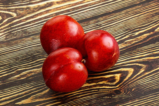Ripe sweet juicy red plum photo