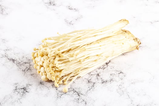 Tasty raw enoki mushroom heap photo