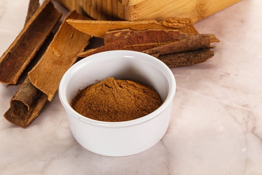 Natural Cinnamon powder with sticks photo