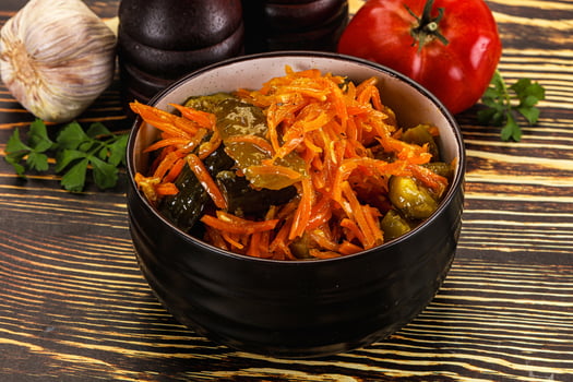 Salad with korean carrot and cucumber photo