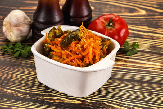 Salad with korean carrot and cucumber photo