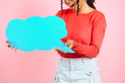 Place For Text. Happy black woman pointing at white advertisement board isolated over pink wall, copyspace. photo