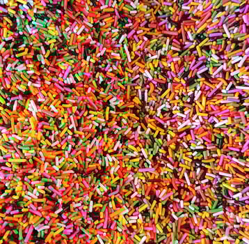 Colorful sprinkles sugar icing topping background photo