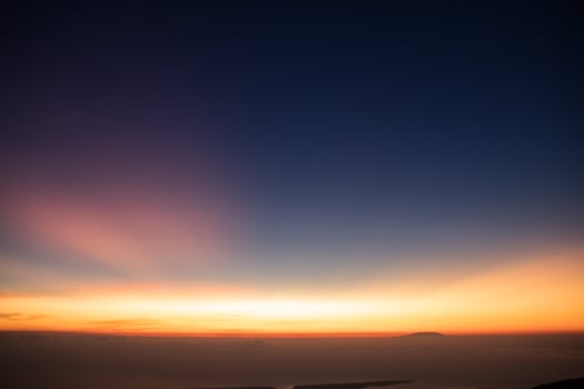 horizon line with orange color when the sun rises in the morning photo