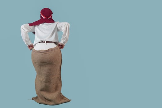 Indonesian woman wearing gunny sack to join competition Indonesian Independence Day celebration. photo