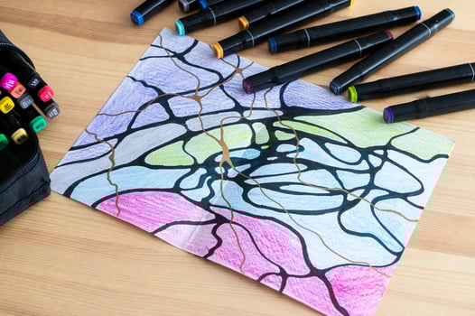 Artistic Creation with Markers on Paper - Vibrant Drawing Process photo