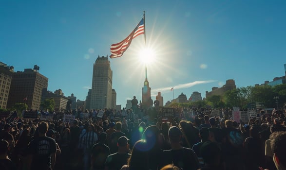 A monumental Labor Day rally at a historic landmark, workers gathered in solidarity with the USA flag soaring above photo