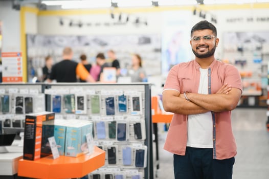Indian man in an electronics store photo