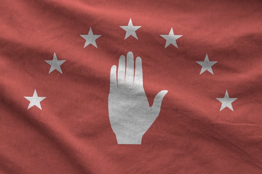Abkhazia flag depicted on folded wavy fabric of old cloth photo
