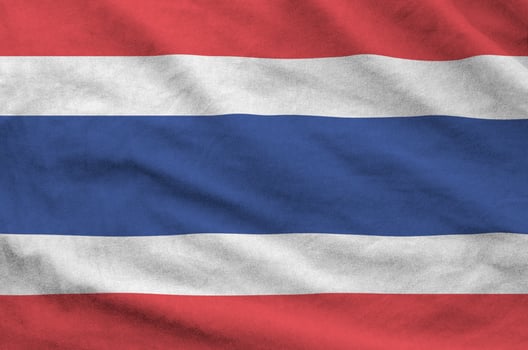 Thailand flag depicted on folded wavy fabric of old cloth photo