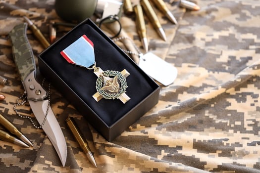 KYIV, UKRAINE - JULY 10, 2024 US Air Force Cross medal. United States military award medal with ribbon and pin. Handmade paper theater props photo