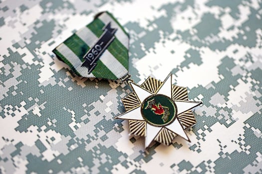 KYIV, UKRAINE - JULY 10, 2024 US Vietnam Campaign Service medal. United States military award medal with ribbon and pin. Handmade paper theater props photo