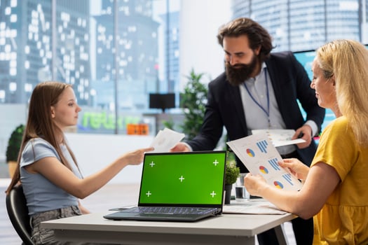 Counselor showing people financial plan on green screen laptop, helping them fulfill economic goals. Advisor teaching clients how to improve financially and increase income using mockup notebook photo