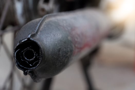 Motorcycle exhaust pipe from old motorcycles. Blurred background of vintage motorcycles. photo