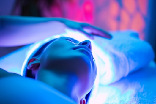 Tranquil Woman Enjoying LED Light Therapy Spa Treatment for Rejuvenation and Relaxation photo