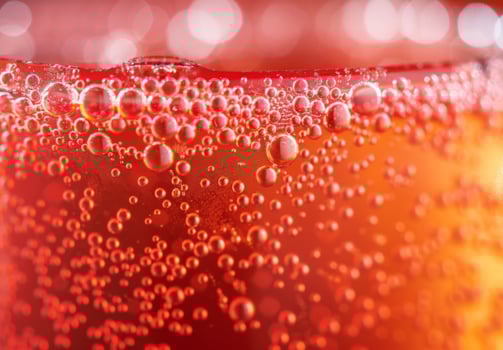 Close-up shot of the bubbly texture of a carbonated soda photo