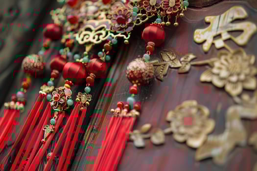Traditional chinese red and gold tassel hanging on a wooden door photo