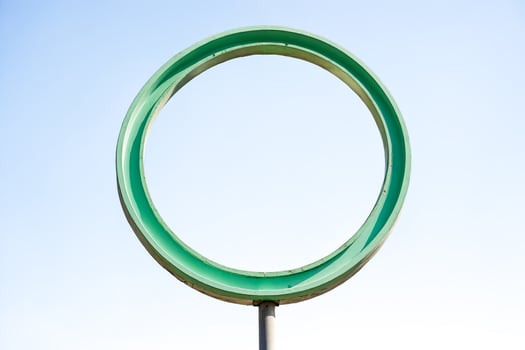 Green Circle Against Blue Sky photo