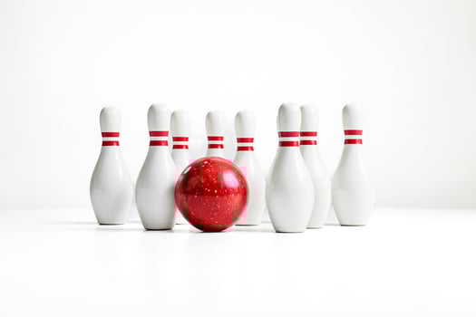 Red Bowling Ball and Pins on White Background photo