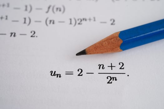 Pencil on mathematic formula exercise test paper in education school. photo