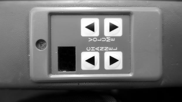Audio control on an armrest of an airplane chair. photo