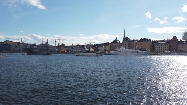 Stockholm, Sweden, June 4, 2022. Warships mingle with tourist boats photo