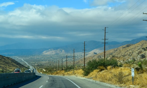 Asphalt Road in a Valley in the Foothills of the California Desert. photo