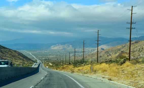 Asphalt Road in a Valley in the Foothills of the California Desert. photo
