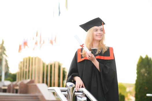 Portrait of a happy woman on her graduation day at university. Education and people. photo