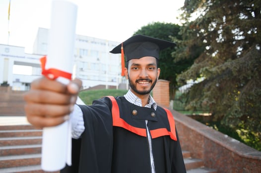 education, graduation and people concept - happy Indian Male graduate student. photo