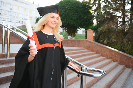 Educational theme graduating student girl in an academic gown. photo