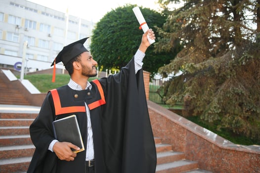 Indian university male student celebrating graduation photo