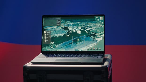 Russian Federal Security Service using radar system to detect ballistic missiles attacking borders. Kremlin regime army using notebook to scan approaching rockets, deploying shields, camera A photo