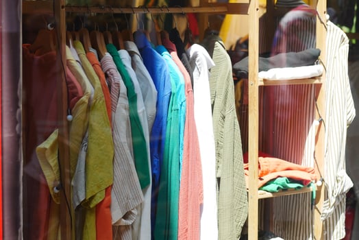 A Vibrant and Colorful Clothing Display Showcased in the Storefront of a Boutique photo