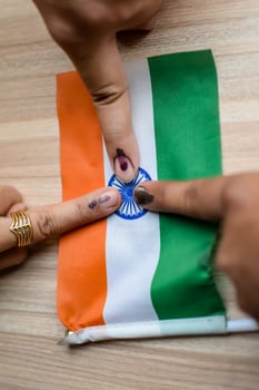 Young voter showing her ink-marked fingers after casting votes near polling booth of east Delhi, India for general Lok Sabha Elections 2024 photo