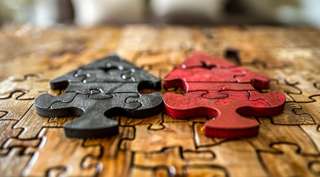 Two puzzle pieces of a Christmas tree on a wooden table photo