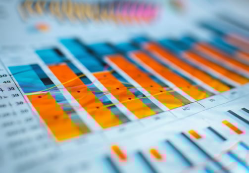 A close up of a growth chart with an upward trend, showing bars and lines photo