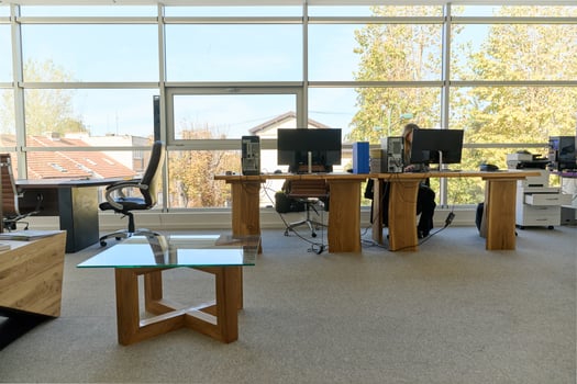 Modern Office Interior with Wooden Furniture, Conference Table, and Computers photo