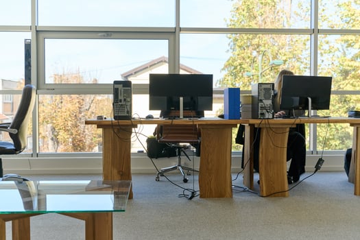 Modern Office Interior with Wooden Furniture, Conference Table, and Computers photo