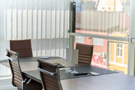 Modern Office Interior with Wooden Furniture, Conference Table, and Computers photo