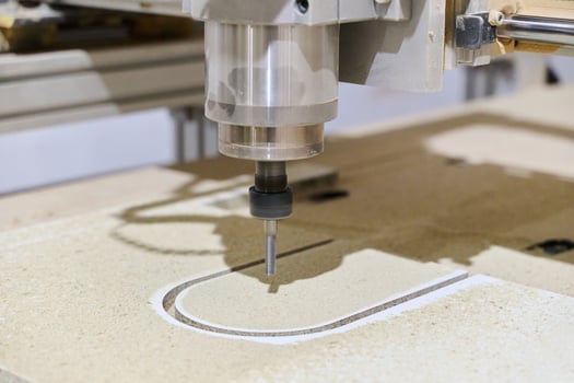 Close-Up of CNC Machine Precisely Cutting and Processing Wooden Boards photo