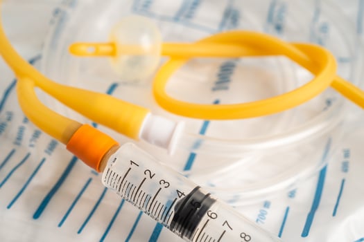 Foley urinary catheter with urine bag for disability or patient in hospital. photo