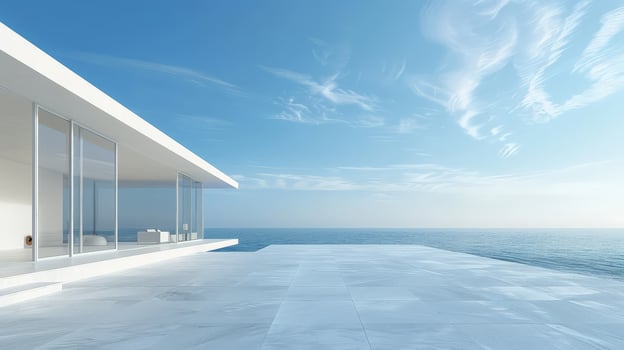 A sleek building harmonizes with serene ocean and bright sky photo